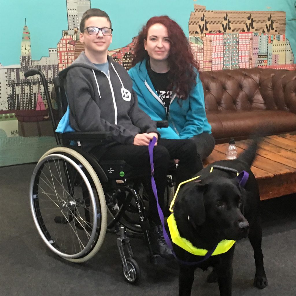 Patrick relearned how to walk with the support of an assistance dog, Henry.