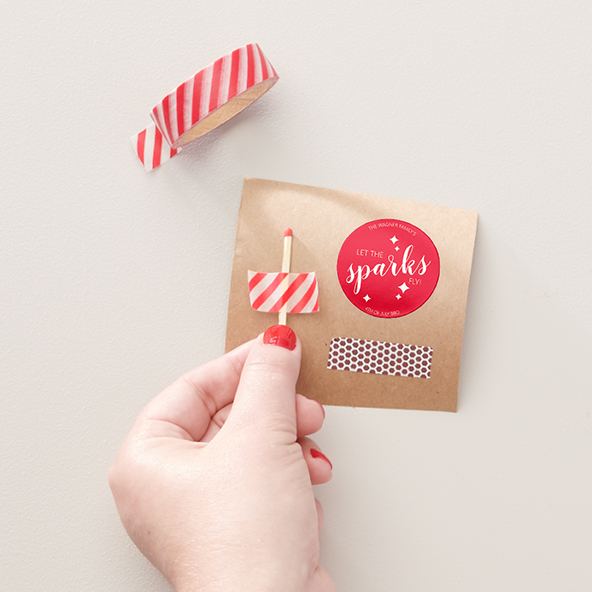 DIY sparkler kits - step 4 remove backing and apply a match paper strip under the sticker