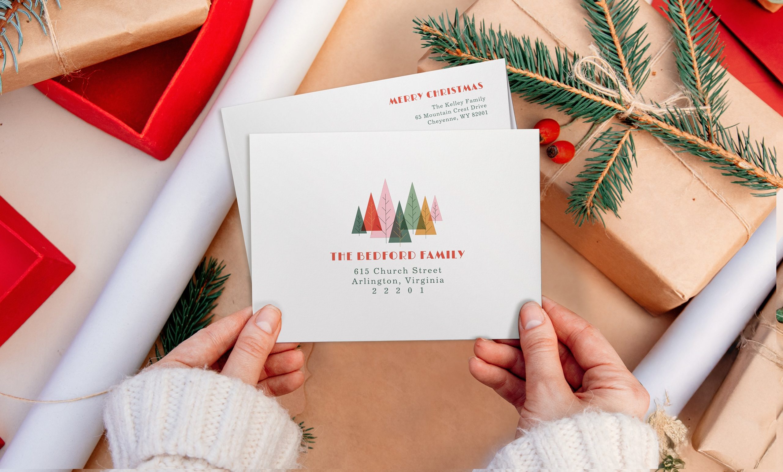 Hands holding Christmas envelope