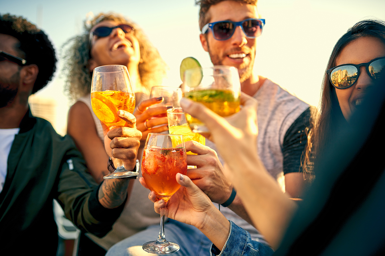 Friends Drinking Outdoors in Sunny Weather