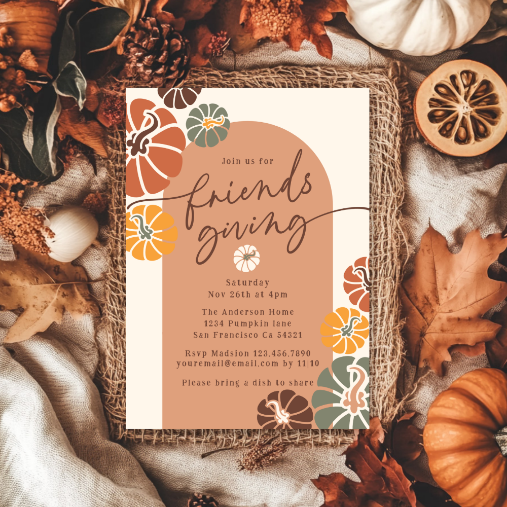 A Friendsgiving invitation with a terracotta arch on a cream background, framed by illustrated pumpkins in orange, yellow, sage green, and brown, resting on a burlap mat surrounded by dried oak leaves, pinecones, linen fabric, white and orange pumpkins, and a dried orange slice.
