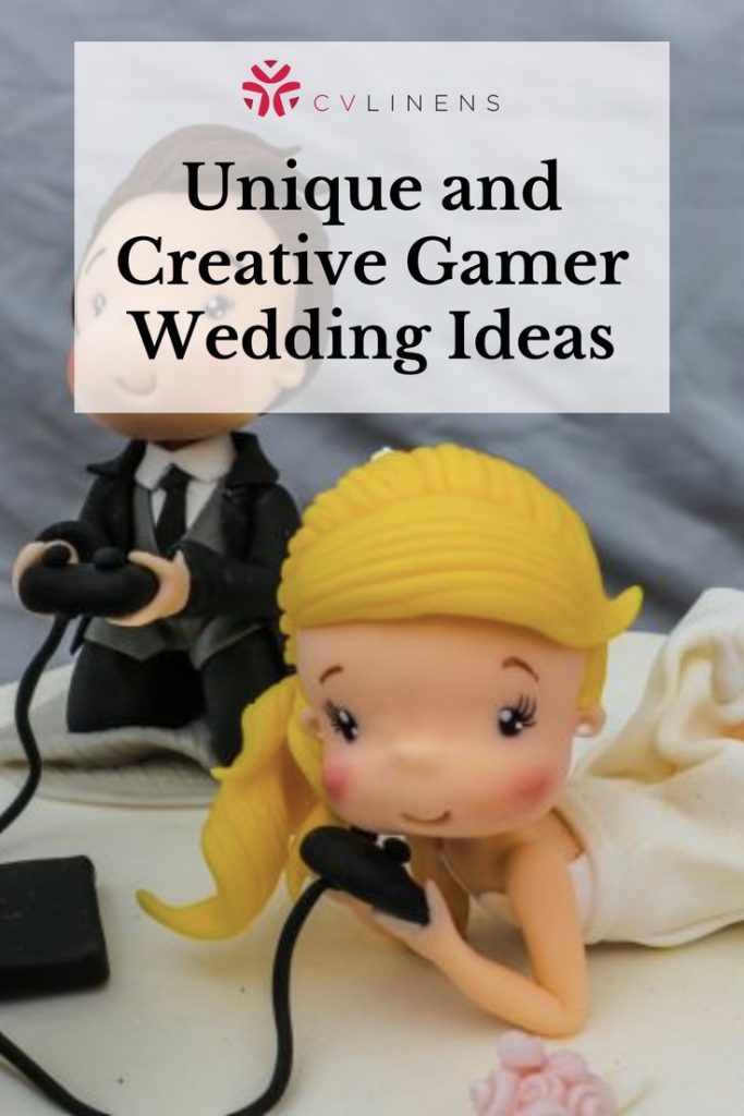 A cake topper depicting a bride and groom with game controllers.