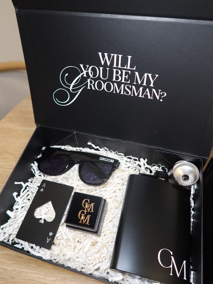 Large groomsman proposal box featuring personalized sunglasses, custom cufflinks, a bottle opener and a monogram flask.