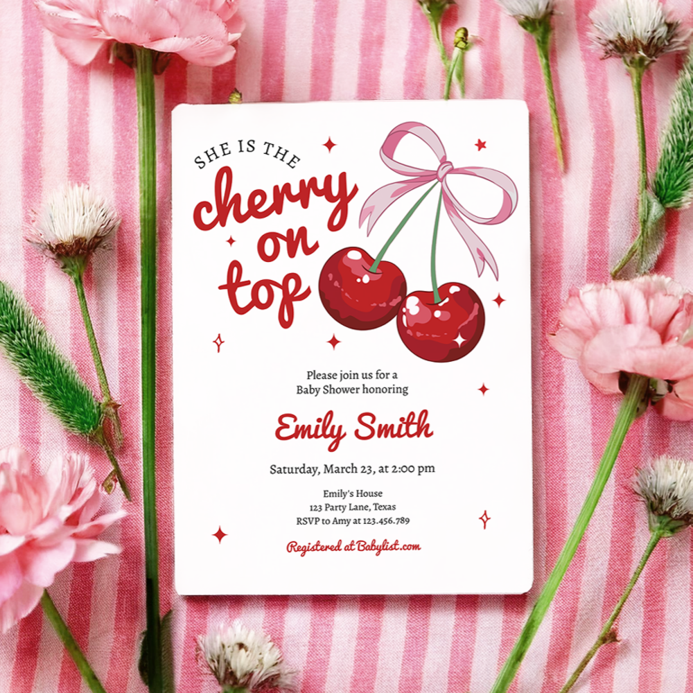 A She is the Cherry on Top baby shower invitation on pink striped background featuring illustrated red cherries with pink bow and playful typography in red and pink color scheme.