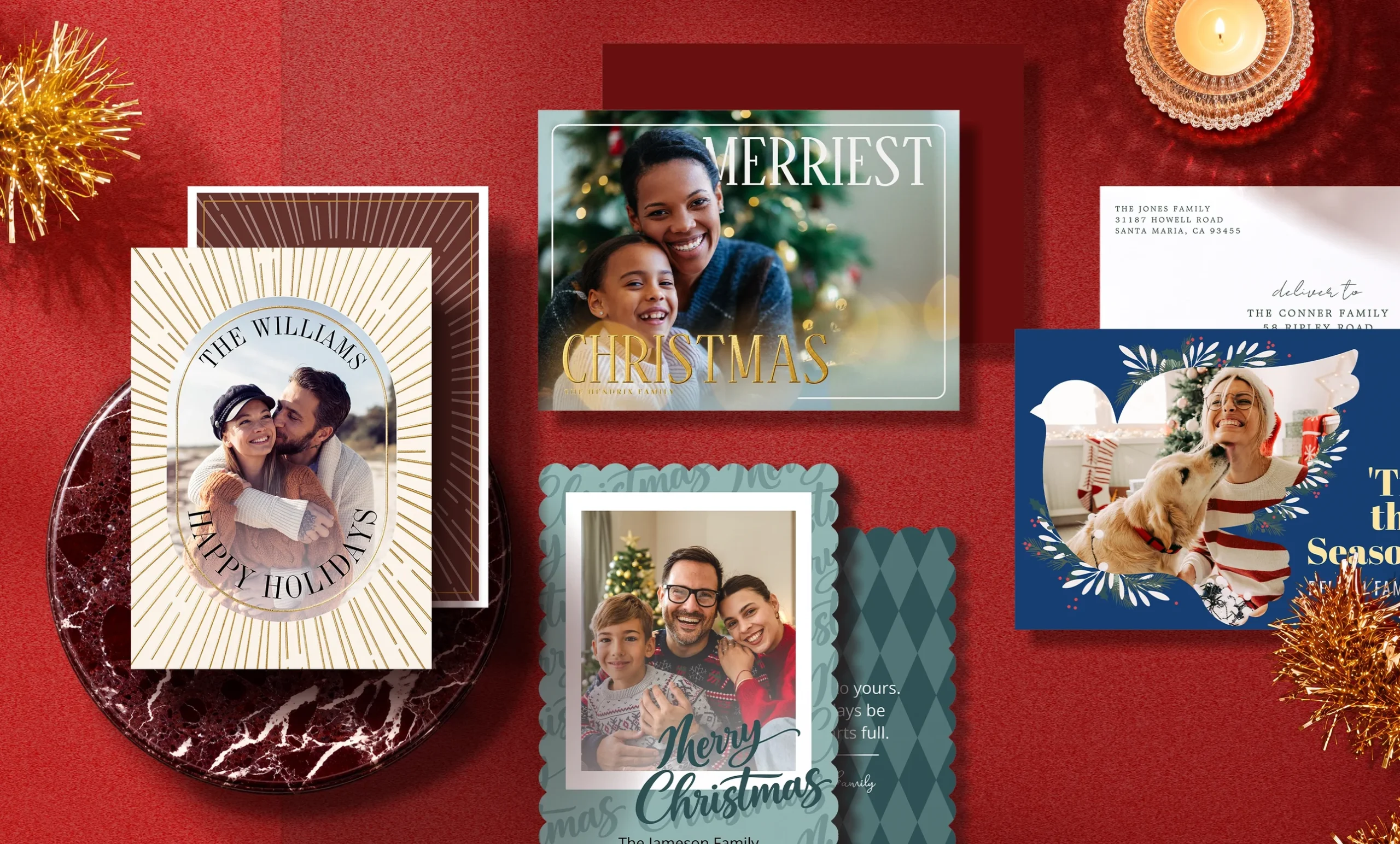 Various holiday cards from Zazzle are shown next to some tinsel and a lighting candle.